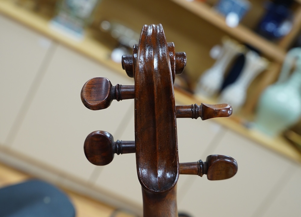 An early 20th century cased Welsh violin, the handwritten label inside the body reads; ‘James Parkinson, Llandudno No.9, 1921’, with a single piece back, inlaid stringing to the edge of the body, length of body 35.5cm, t